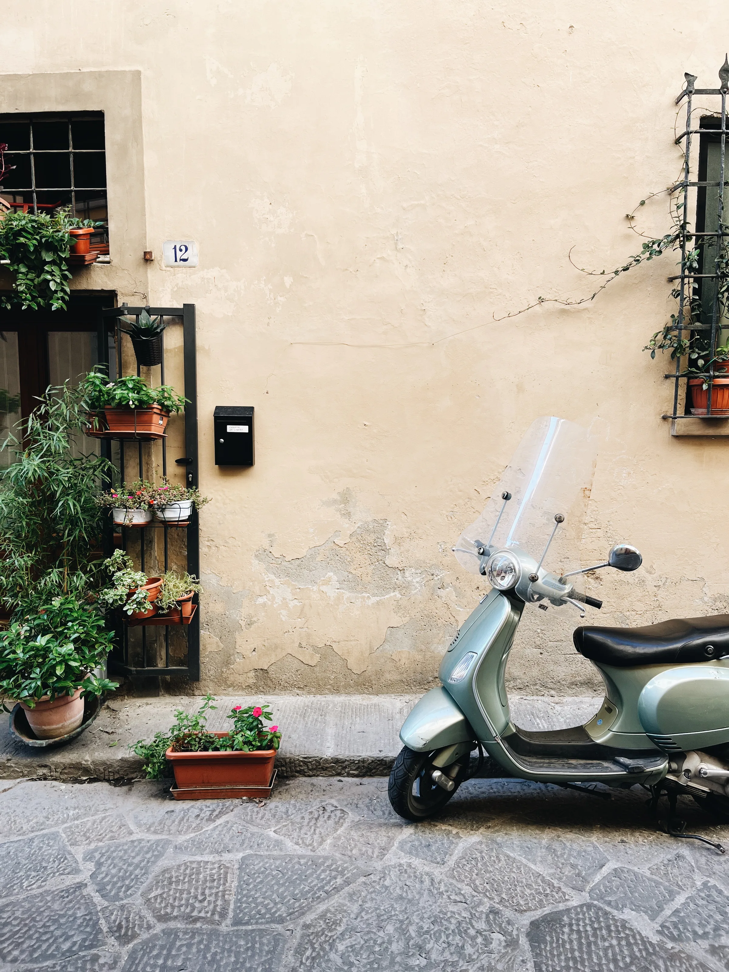 Vespa parked on a quiet village street